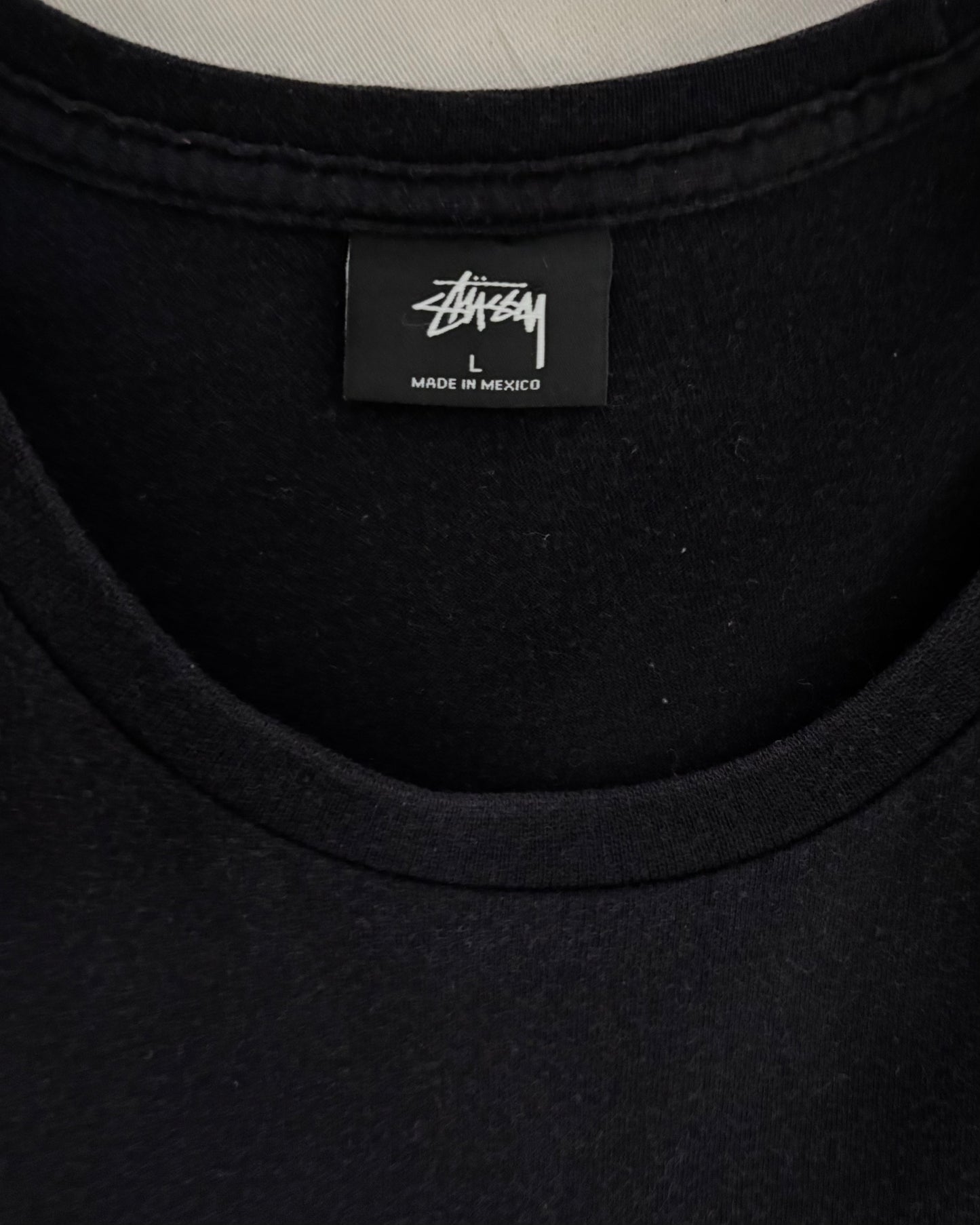 〈STUSSY〉 Face Logo Back Print T-Shirt